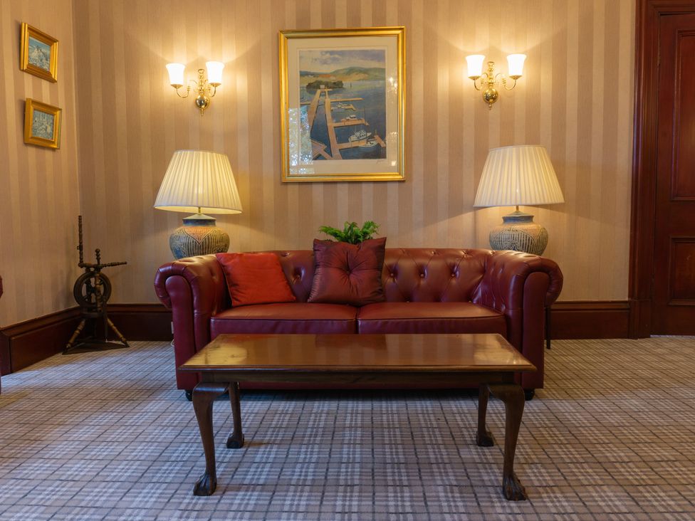 A living room with a sofa and coffee table at Newton Manor House in Cupar