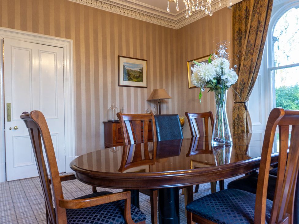 A dining room with a table and chairs at Newton Manor House in Cupar