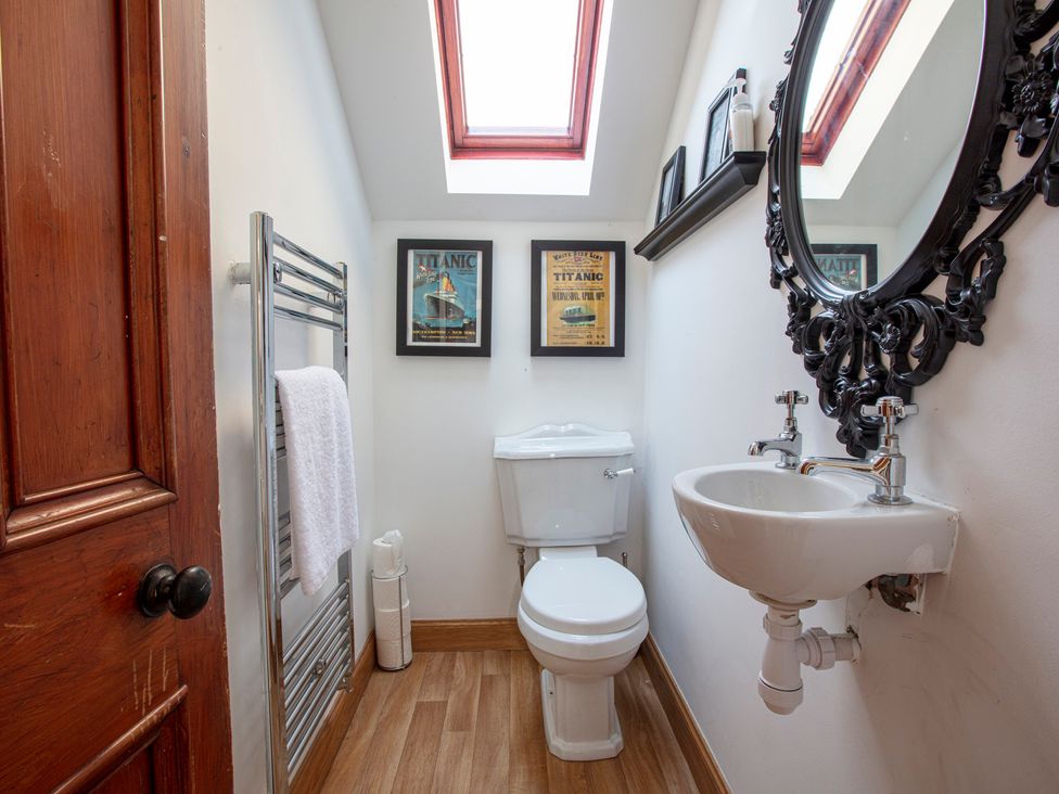 A bathroom with a toilet and hand basin at Newton Manor House in Cupar