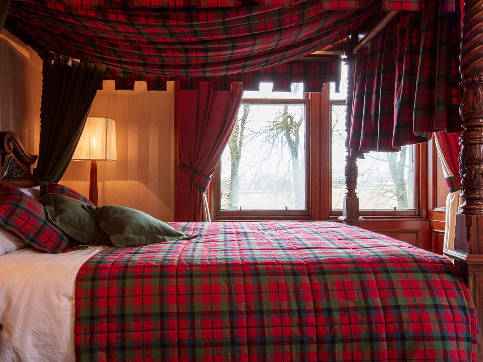 A bedroom with a bed and window at Newton Manor House in Cupar