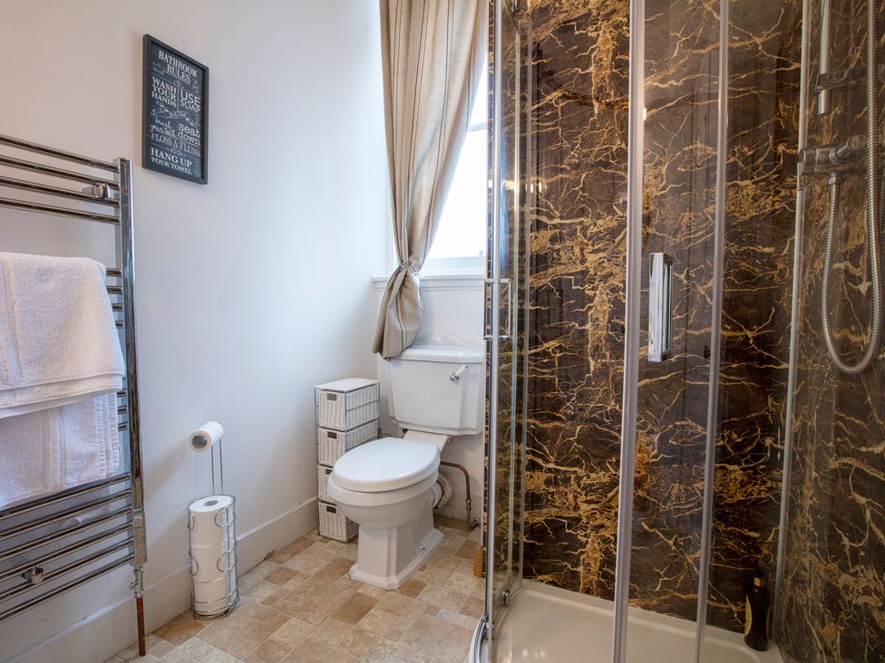 A bathroom with a shower and a toilet at Newton Manor House in Cupar