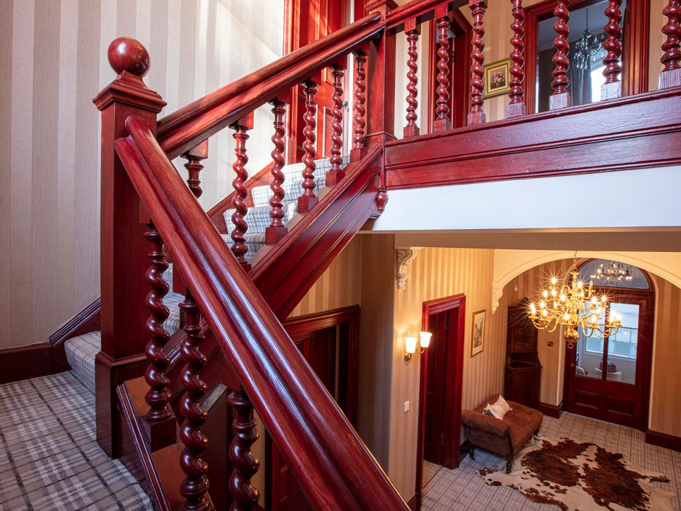 A staircase leading to an upper level in the hallway at Newton Manor House Cupar