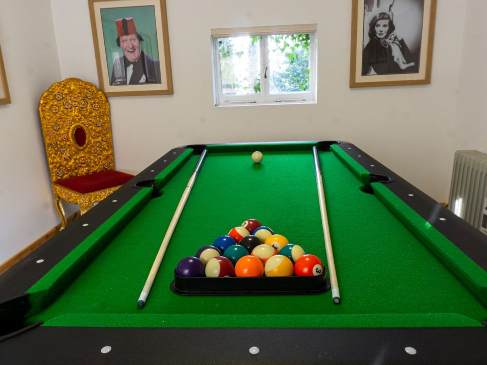 A game room with a pool table and framed pictures at Newton Manor House in Cupar