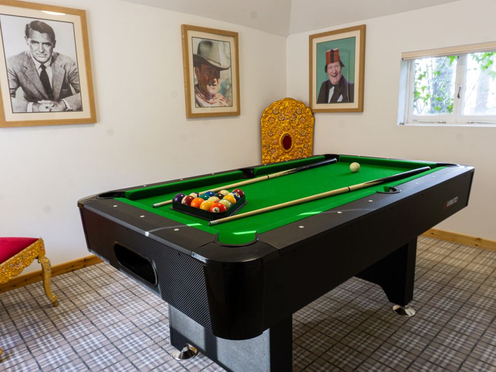 A game room with a pool table and wall art at Newton Manor House in Cupar