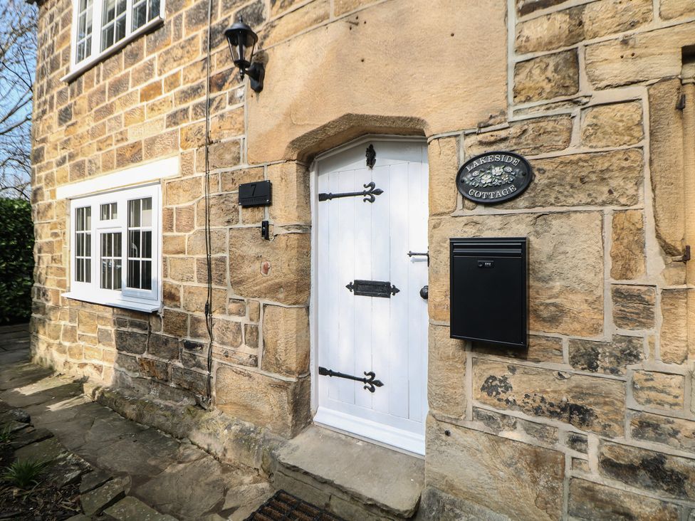 The entrance of Lakeside Cottage in Wakefield with a front door and mailbox