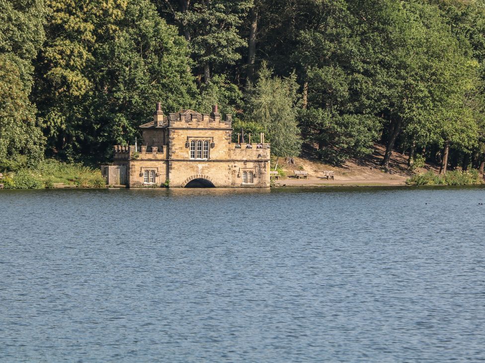 A building near a lake at Lake Side Cottage Wakefield