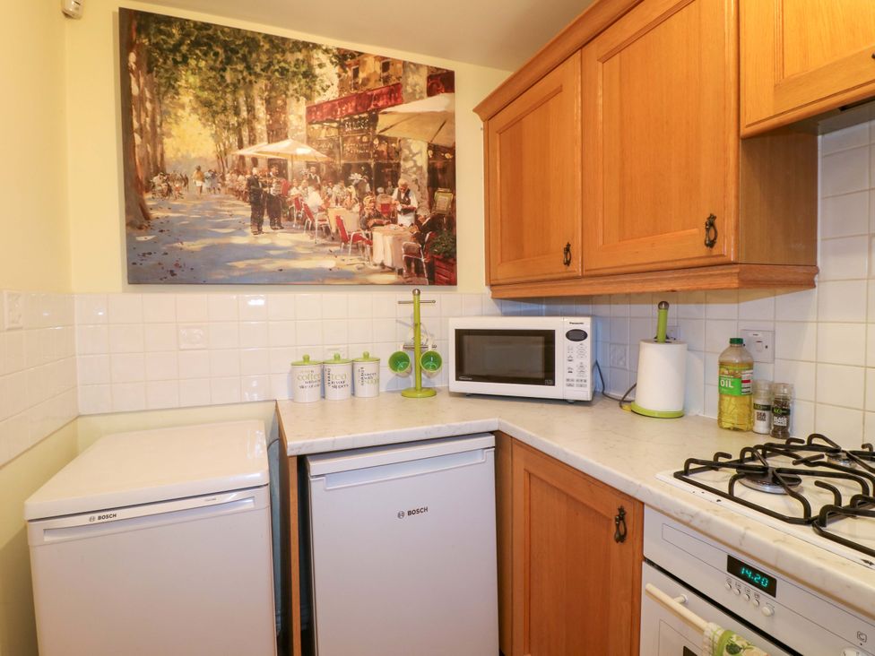 A kitchen with appliances and cabinetry at 41 Lower Birches Way Rugeley