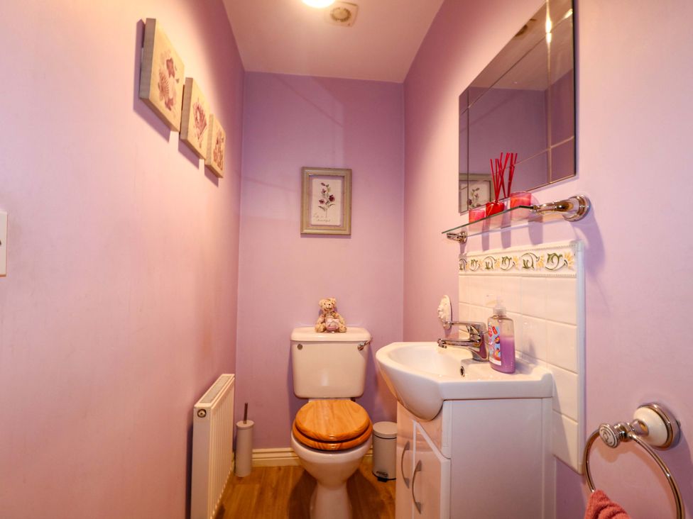 A bathroom with a toilet and sink at 41 Lower Birches Way in Rugeley