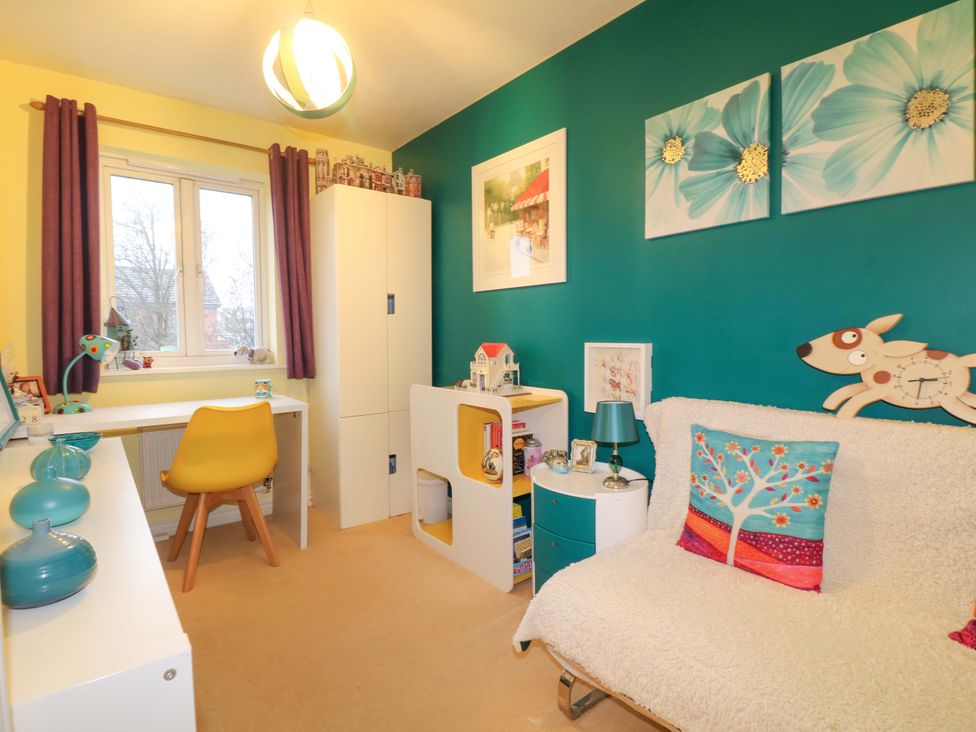 A bedroom with a desk and chair at 41 Lower Birches Way Rugeley