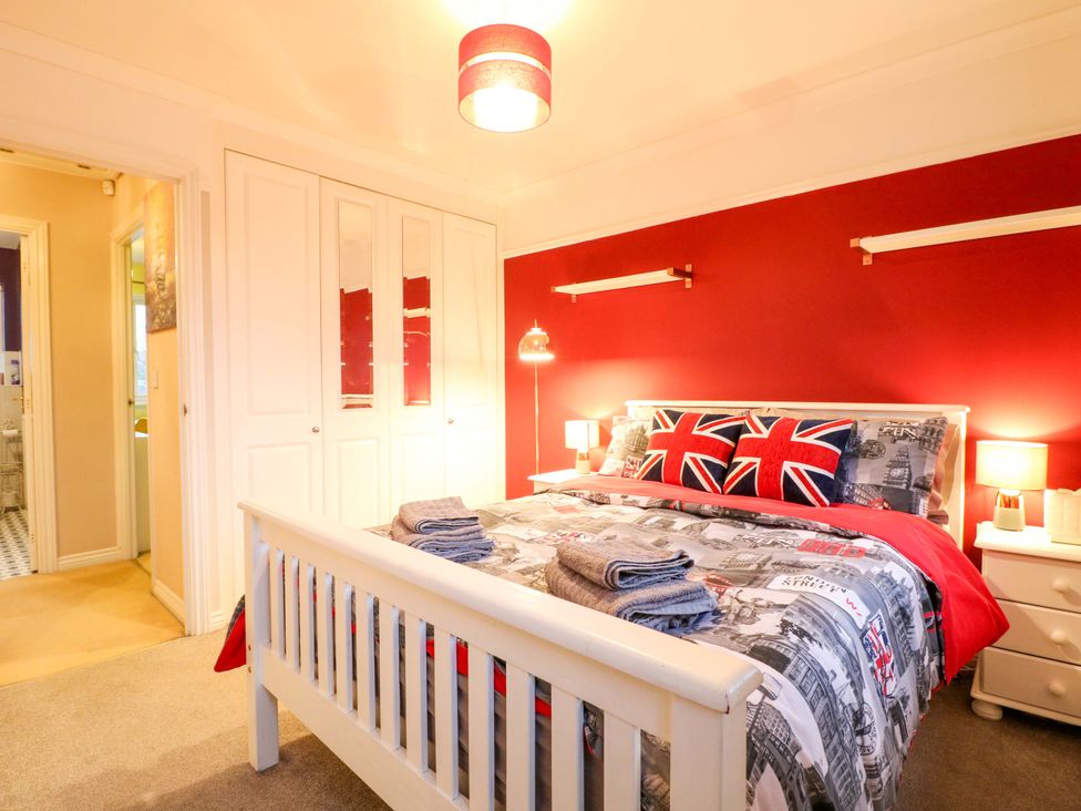 A bedroom with a bed and wardrobe at 41 Lower Birches Way Rugeley