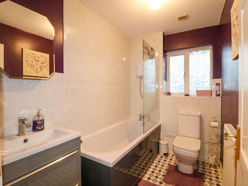 A bathroom featuring a bath tub sink and toilet at 41 Lower Birches Way Rugeley