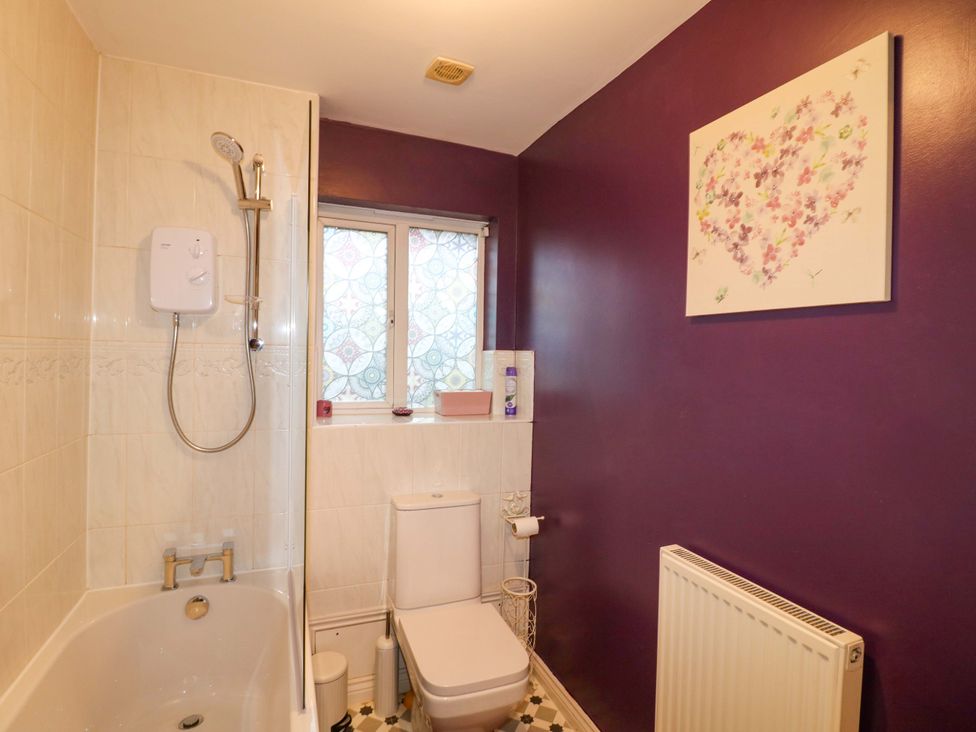 A bathroom with a bathtub and toilet at 41 Lower Birches Way Rugeley