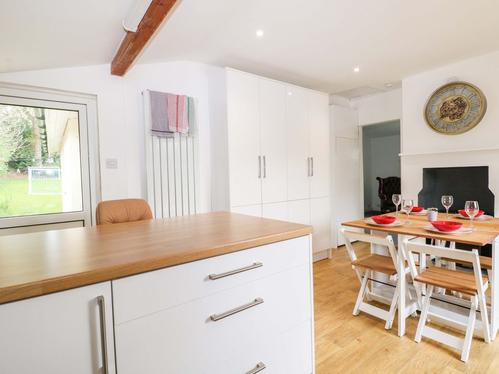 A kitchen with a dining area and window at Woodside in Battle