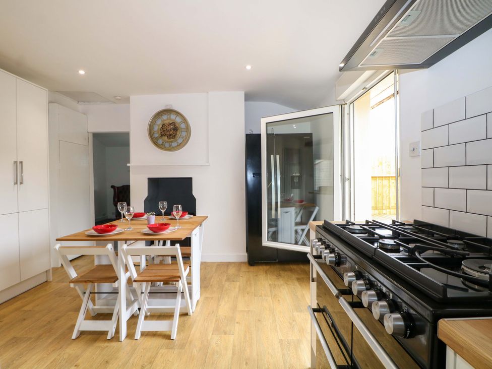 A kitchen with a table and chairs at Woodside in Battle