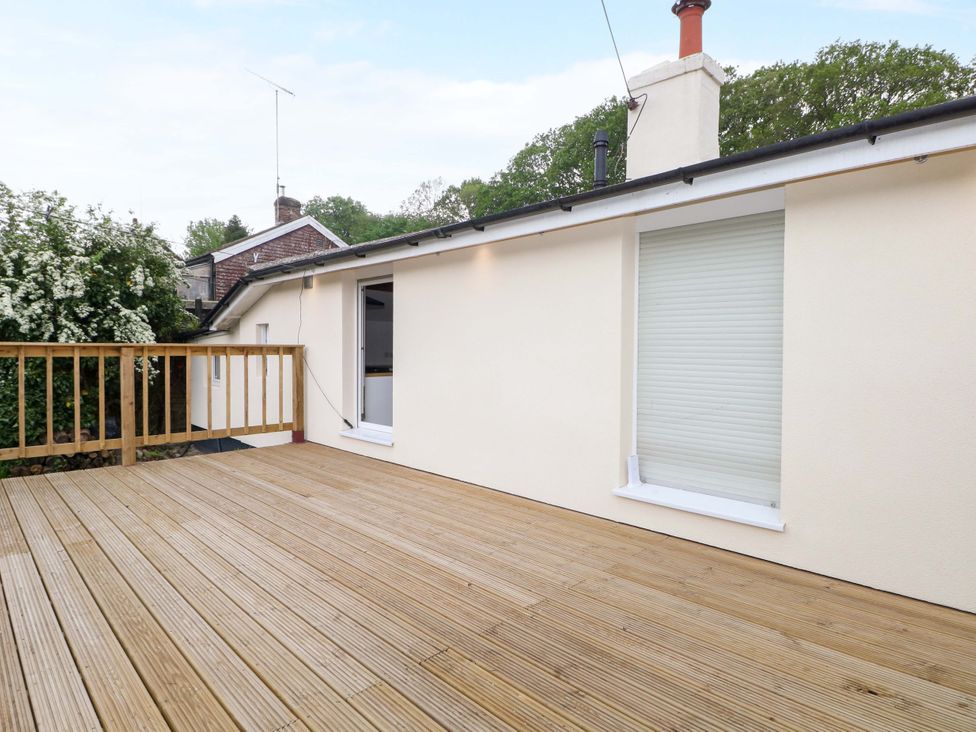 An outdoor area with decking and a view of a window at Woodside in Battle