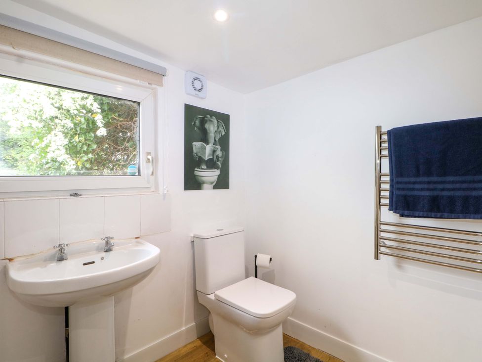 A bathroom with a toilet and sink at Woodside in Battle