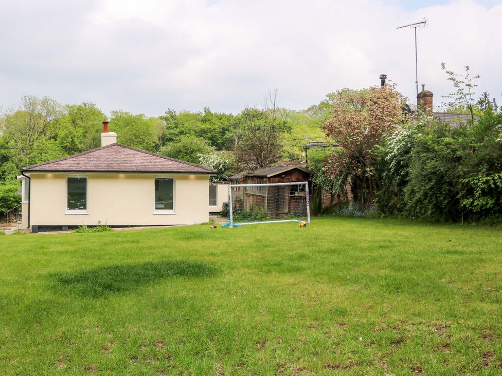 A house with a goalpost in the garden at Woodside, Battle