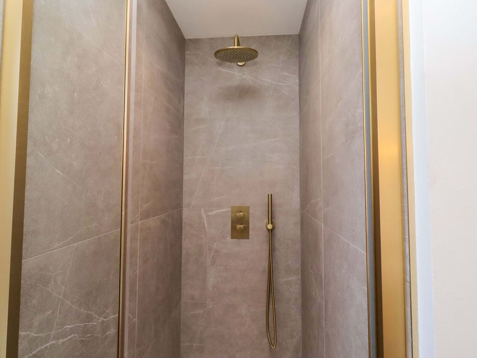 A shower with a rainfall shower head at 1 Dairy Fields Longframlington