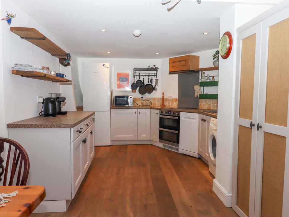 A kitchen with appliances and utensils at Park Cottage in Kingsbridge
