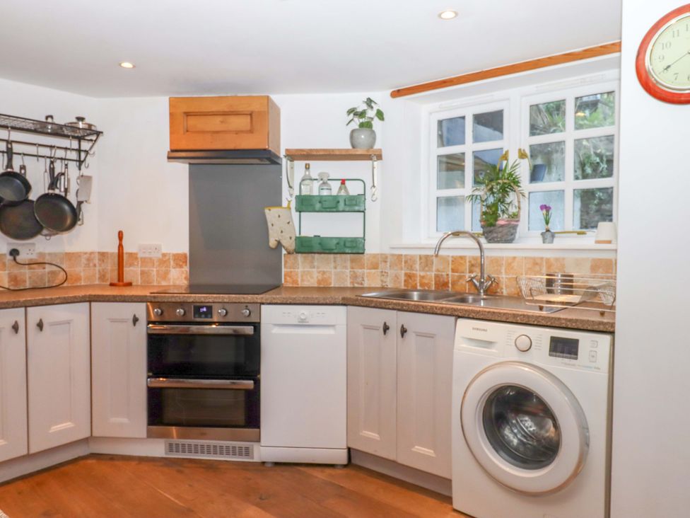 A kitchen with appliances and utensils at Park Cottage in Kingsbridge