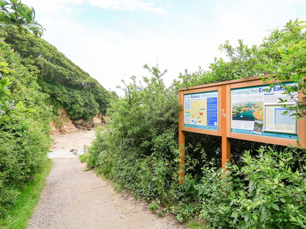 A pathway leading to the Erme Estuary information sign at Park Cottage in Kingsbridge