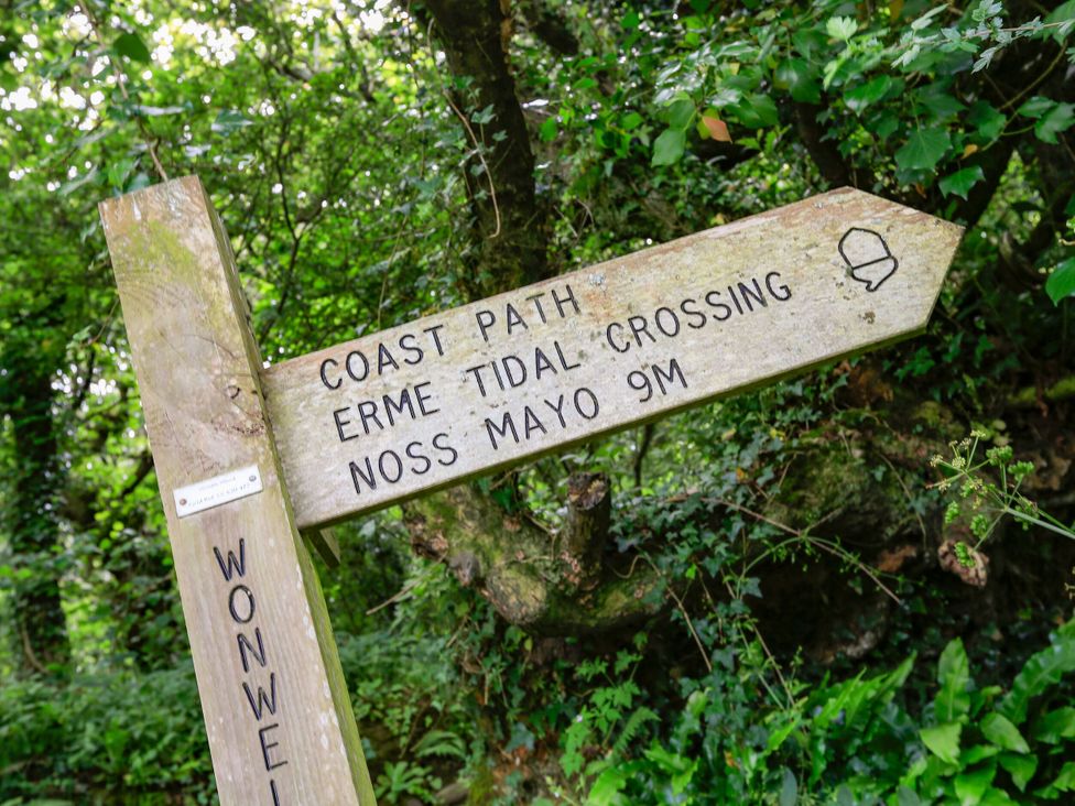 A signpost for the Coast Path and Erme Tidal Crossing near Noss Mayo