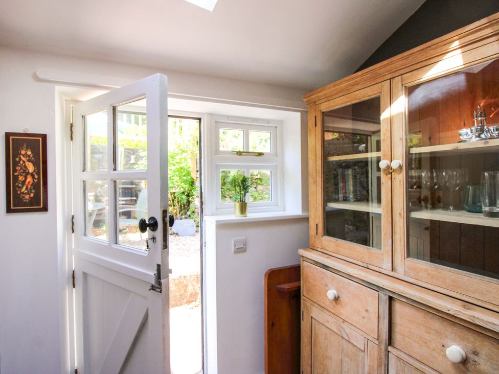 A kitchen with a door and window at Park Cottage in Kingston, Kingsbridge