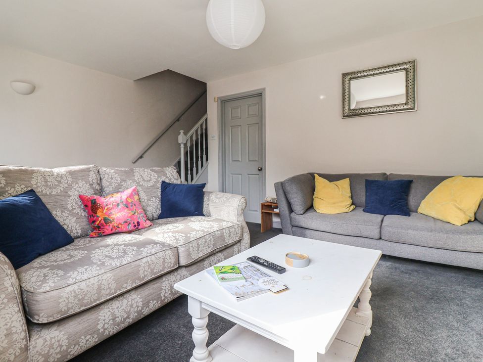 A living room with sofas and a coffee table at Mallard Cottage in Nafferton