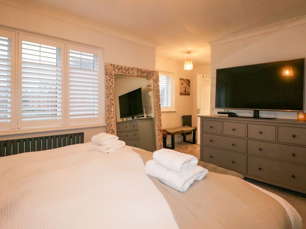 A bedroom with a bed and television at Number 5 