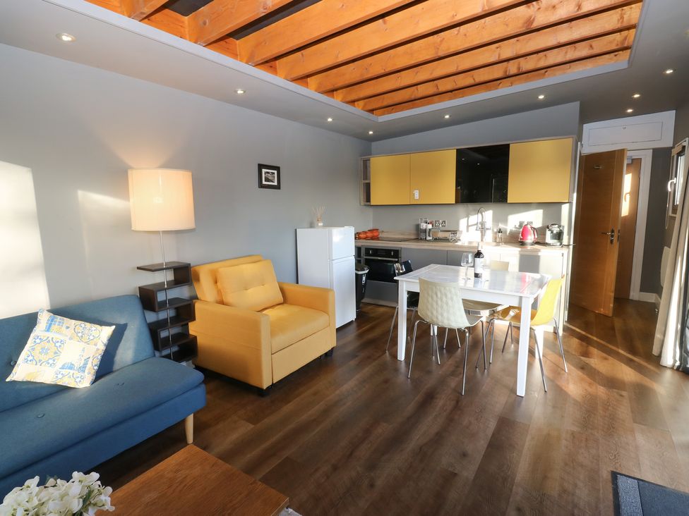 A kitchen with a table and chairs at The Luxury Shed in Huddersfield