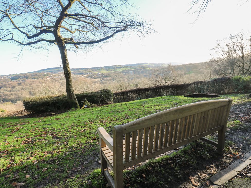 A bench overlooking a view in an outdoor area at The Luxury Shed in Huddersfield