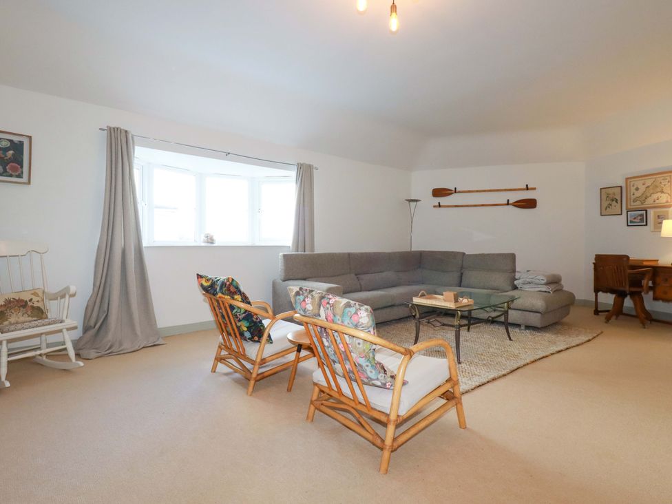 A living room with a sofa a coffee table and chairs at Cribba