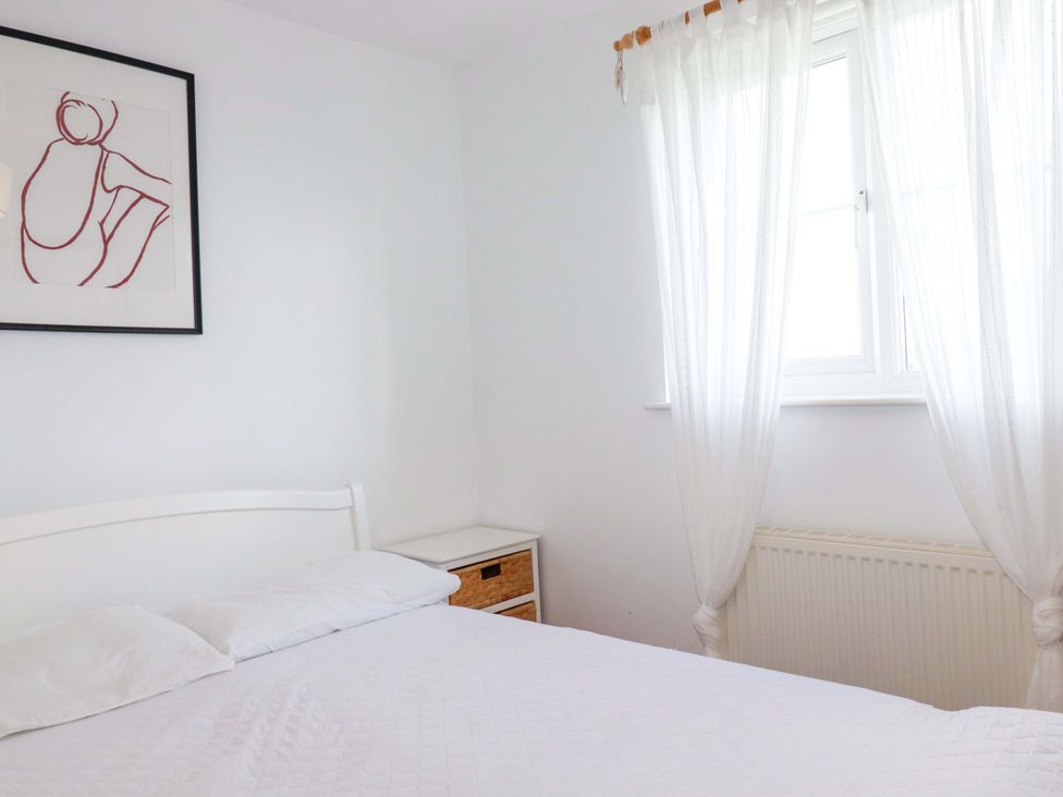 A bedroom with a bed and dresser at Cribba