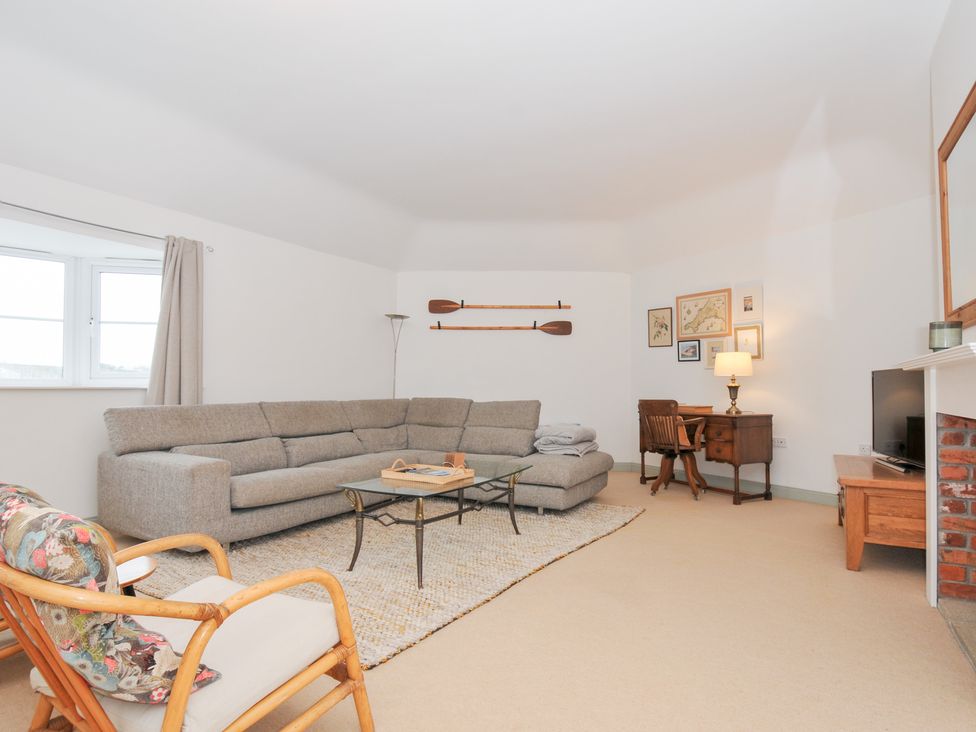 A living room with a sofa and coffee table at Cribba in Port Isaac