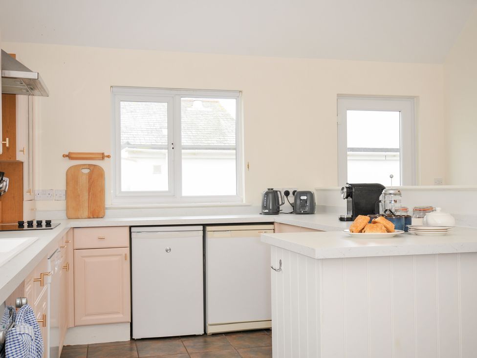 A kitchen with appliances and a countertop at Cribba in Port Isaac