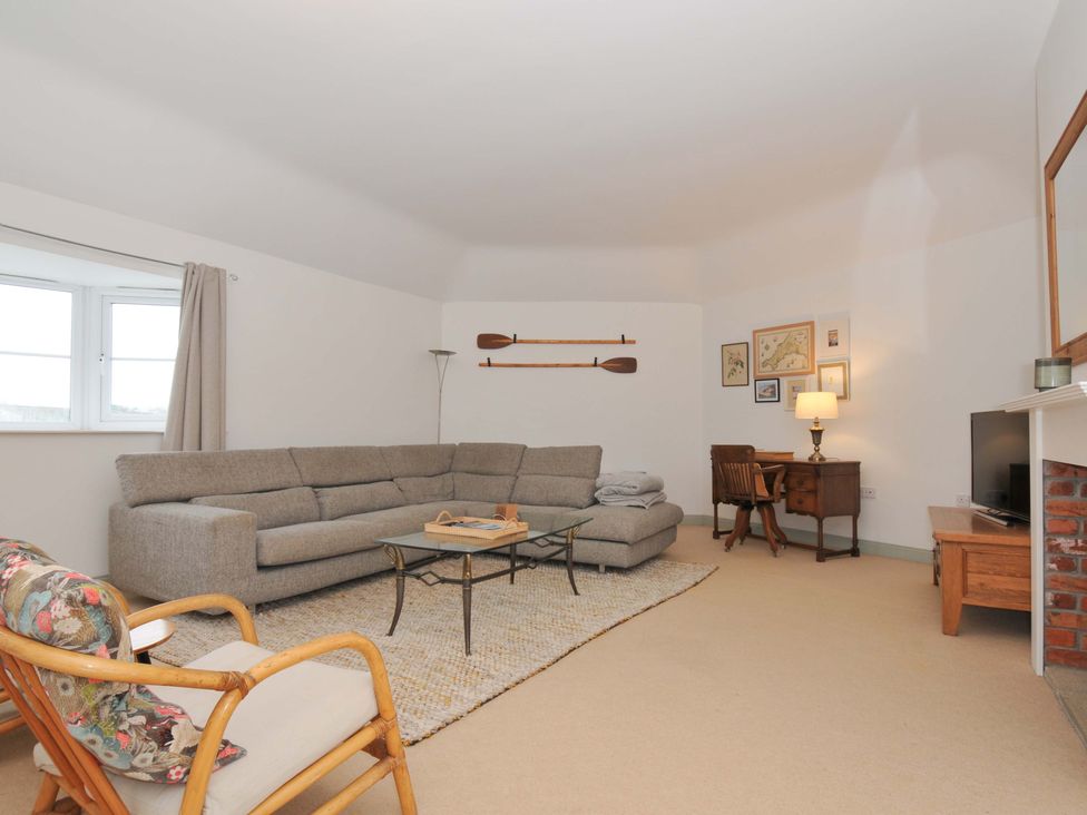 A living room with a sofa and coffee table at Cribba in Port Isaac