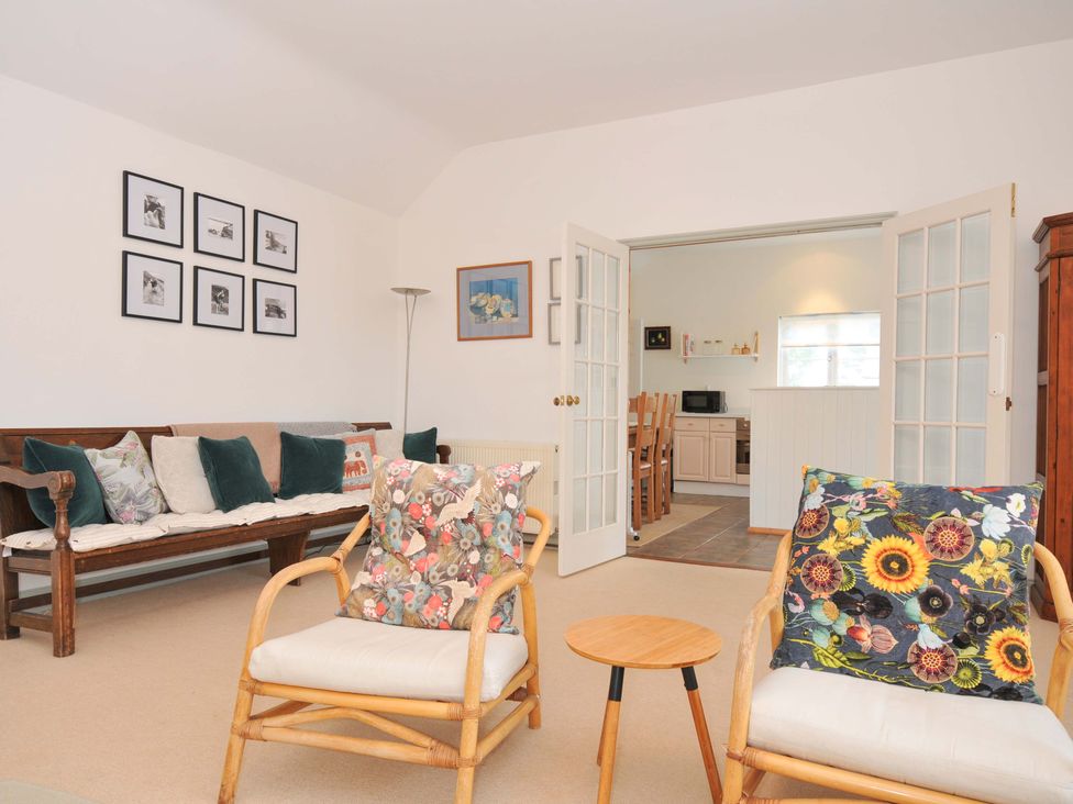 A living room with a sofa and chairs at Cribba, Port Isaac