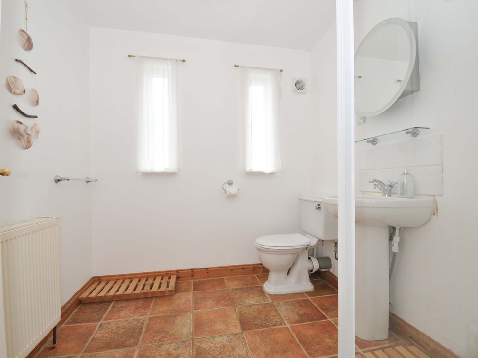 A bathroom with a sink and toilet at Cribba in Port Isaac