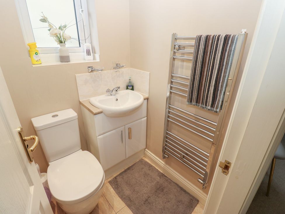 A bathroom with a sink and toilet at The Annex at Ryefield Lodge