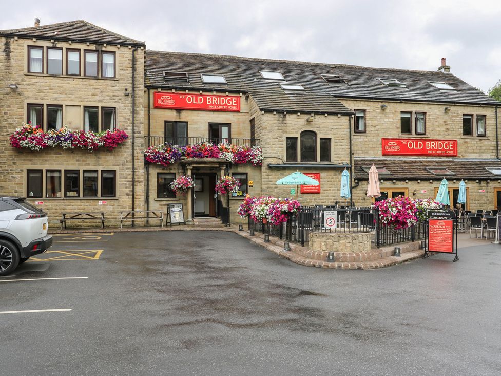 A building with outdoor seating at The Old Bridge in 