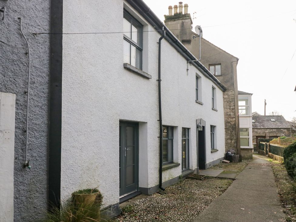 An exterior view of a residential building with windows and a path at No.2 The Flags, Grange-over-Sands