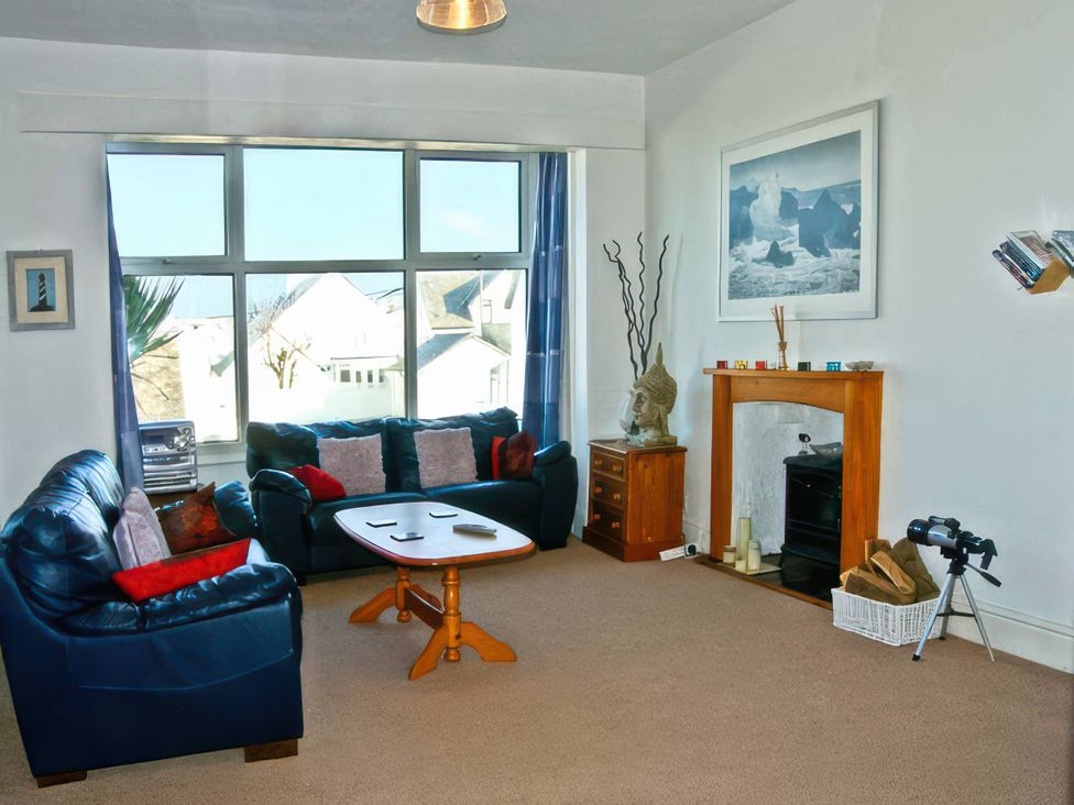 A living room with sofas and a coffee table at Morlais in Rhosneigr