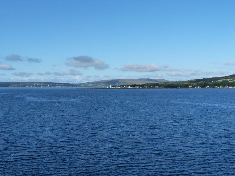 A view of water and land with buildings at Serenity Lodge Wemyss Bay
