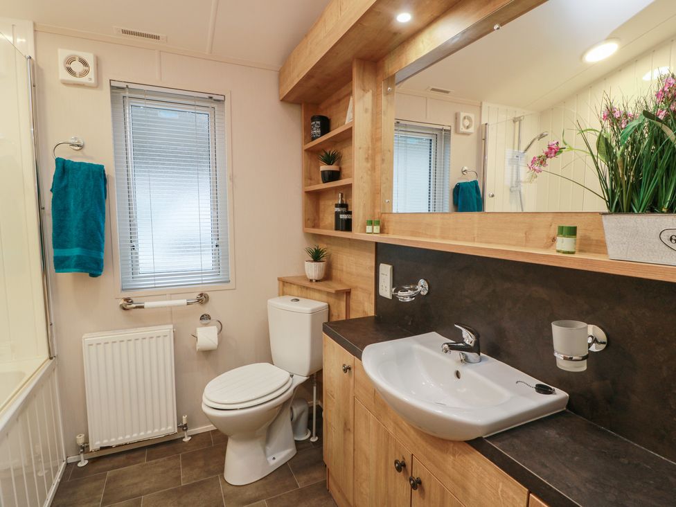 A bathroom with a sink and toilet at Serenity Lodge in Wemyss Bay