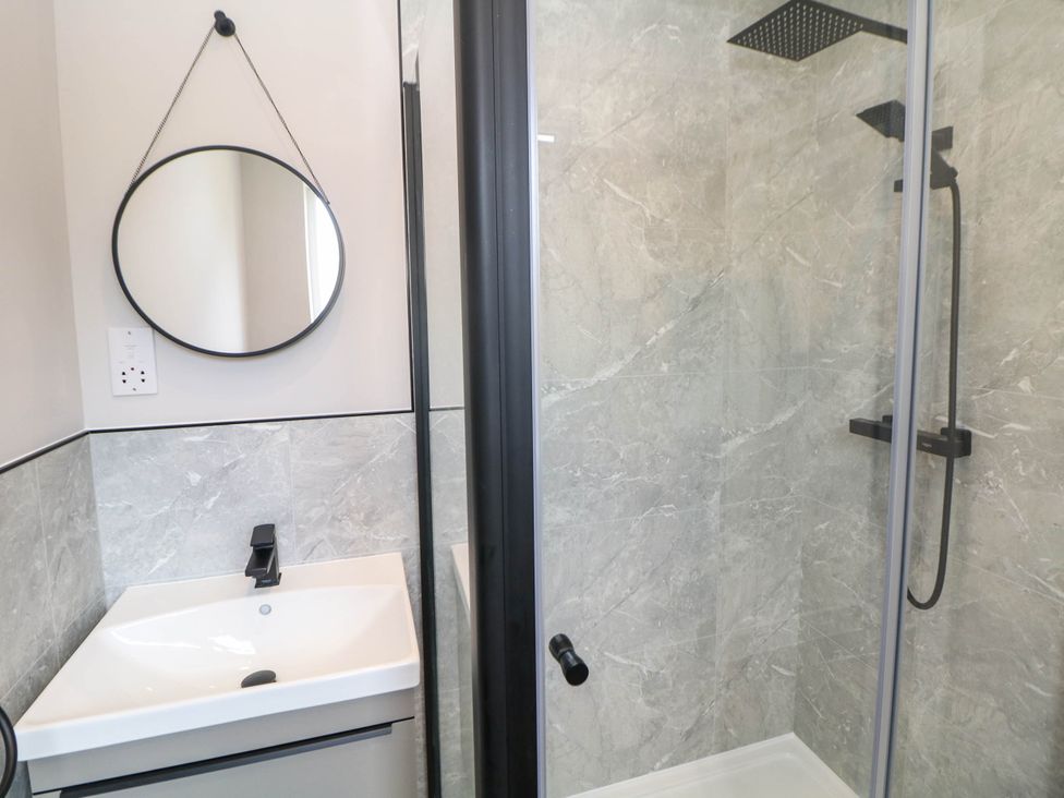 A bathroom with a sink and shower at The Bungalow in Matlock