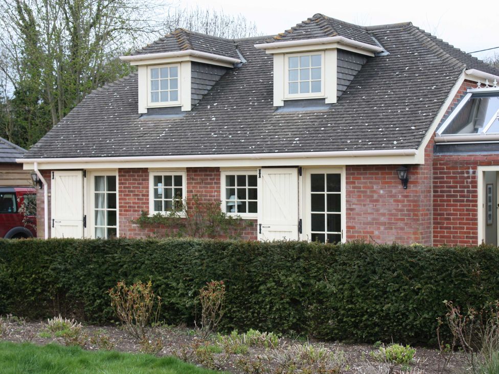 A house exterior with windows and doors at New Barn in Broad Chalke