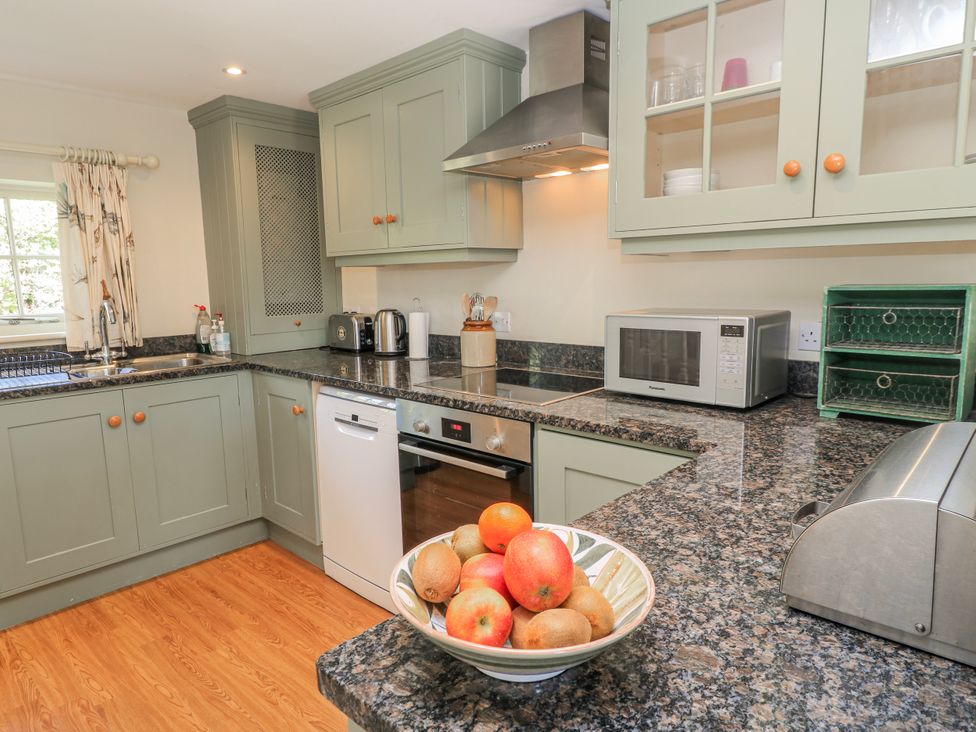 A kitchen with appliances and a fruit bowl at New Barn in Broad Chalke