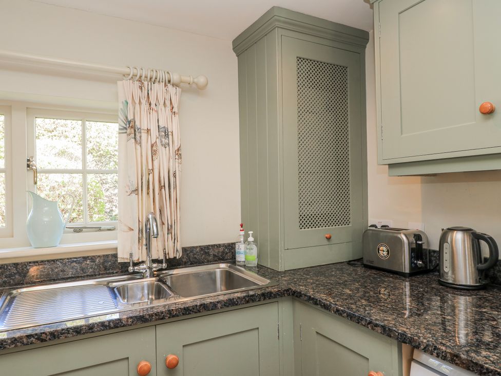 A kitchen with a sink and window at New Barn in Broad Chalke
