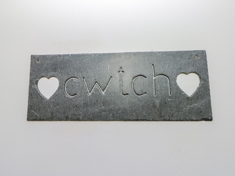 A slate sign with the word cwtch at The Cwtch in Haverfordwest