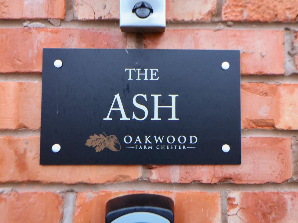 A nameplate reading The Ash at Oakwood Farm Chester